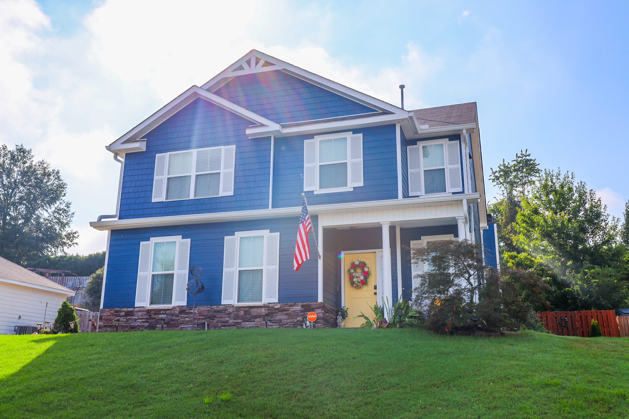 Home exterior with yellow door